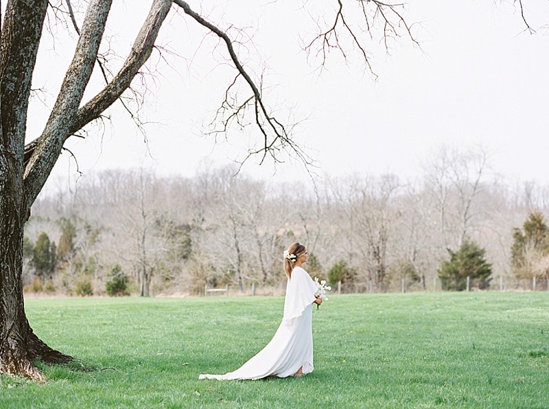bride walking in grass at Ashbourne Farms 