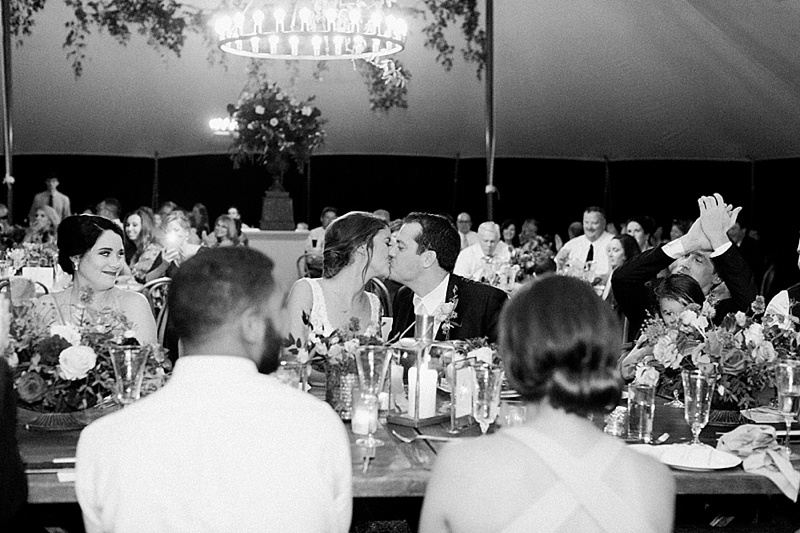bride and groom kiss at reception